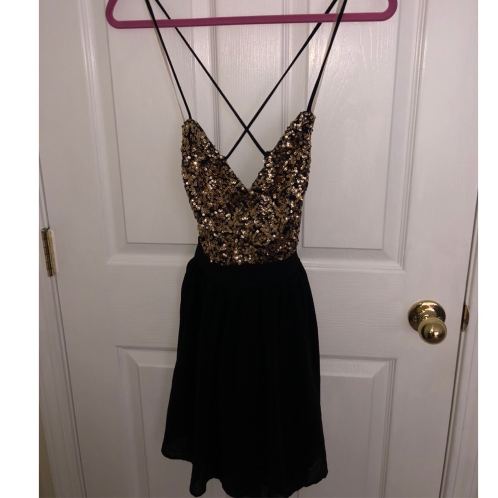 Black open back, gold sequin dress